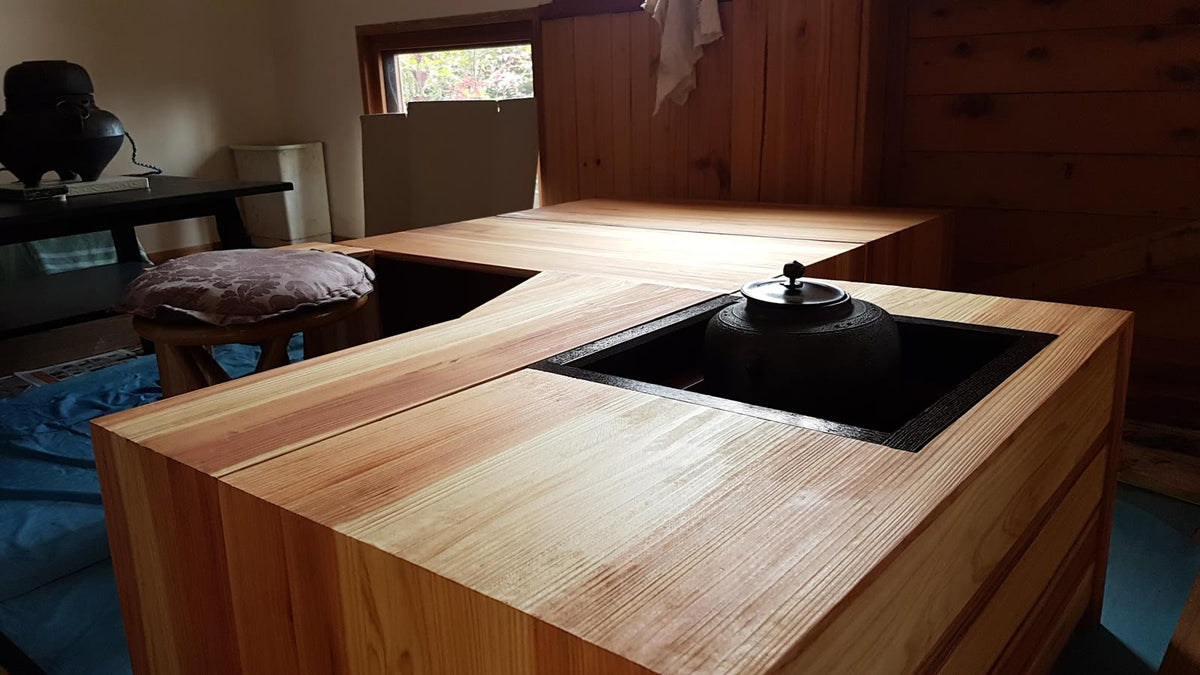 Tea ceremony teacher Ryoko Freeman serving tea at the Ryurei table