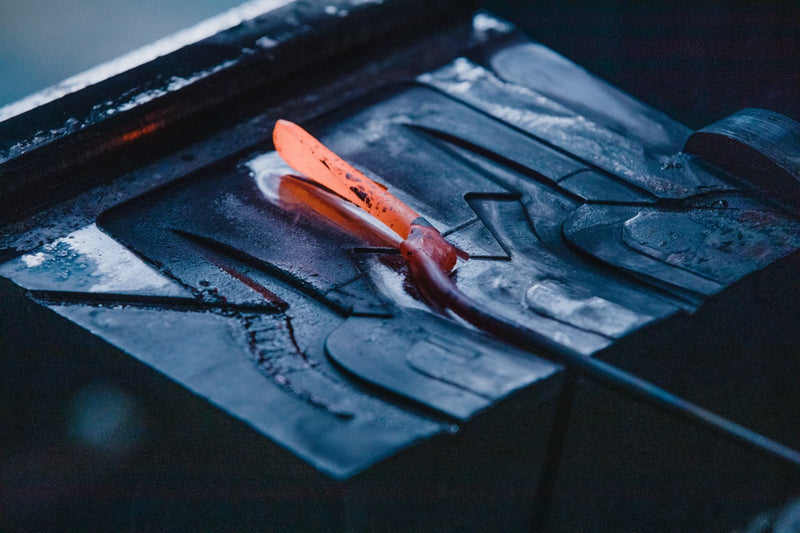Glowing steel being drop-forged at the Toyama Hamono workshop in Sanjo, Japan