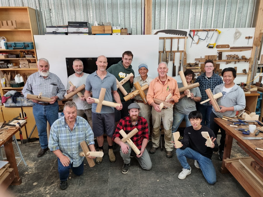 Students holding the joints they made in a past class at JTA