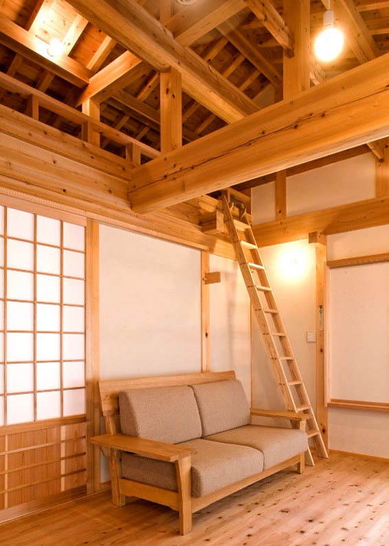 Interior of the Yamada house with a timber ladder and shoji screens